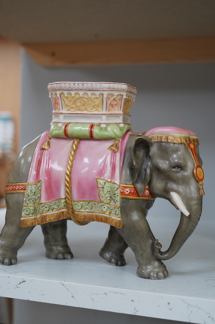 A Hadley's Worcester elephant with howdah and two Hadleys vases, peacock decoration, tallest 19.5cm. Condition - good